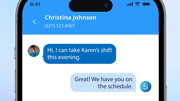A care agency coordinator reviewing operational data on a computer